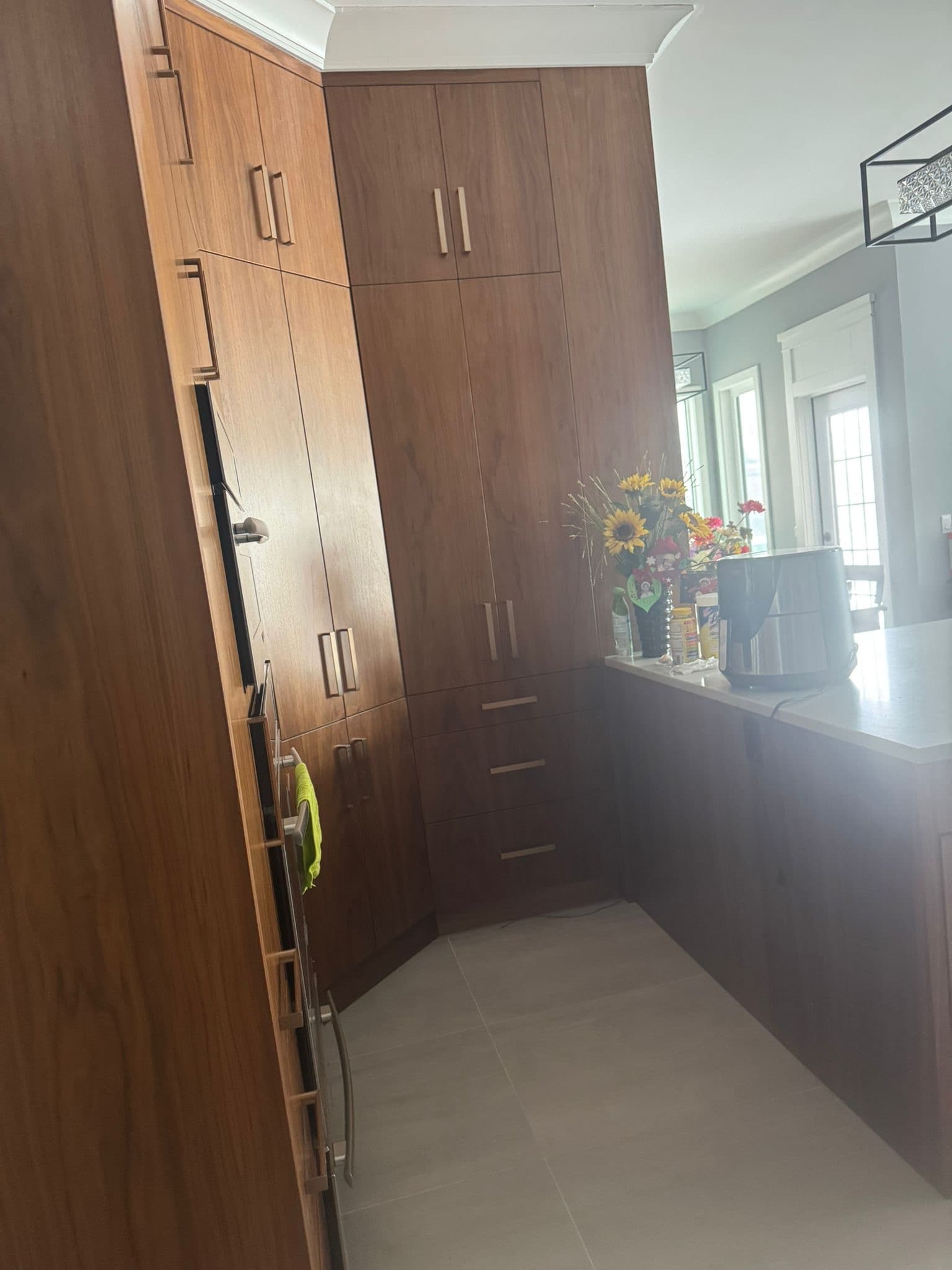 Modern kitchen with custom cabinets and island by YYC Cabinets Calgary
