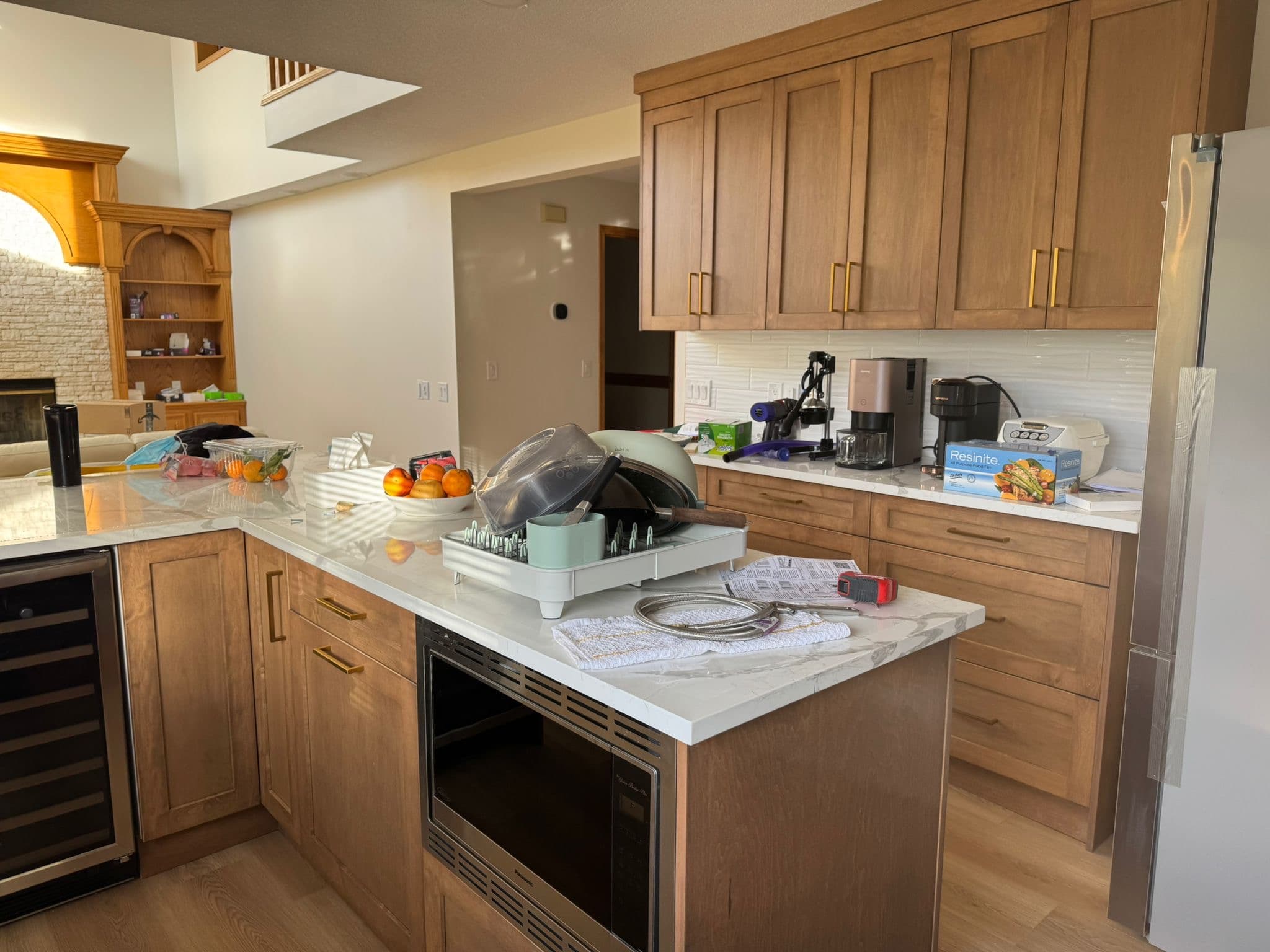 Warm wood custom kitchen with island built by YYC Cabinets in Calgary